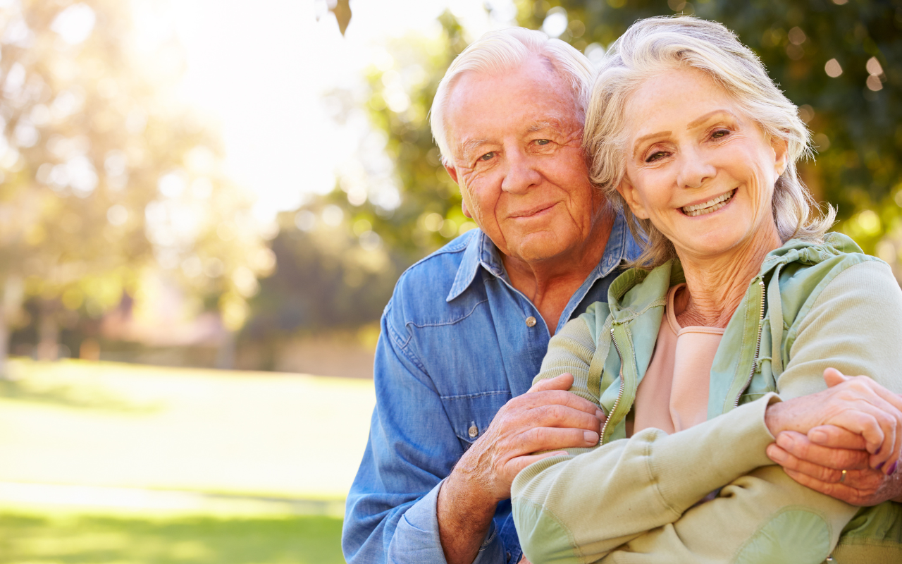 Two older people a man and woman smiling