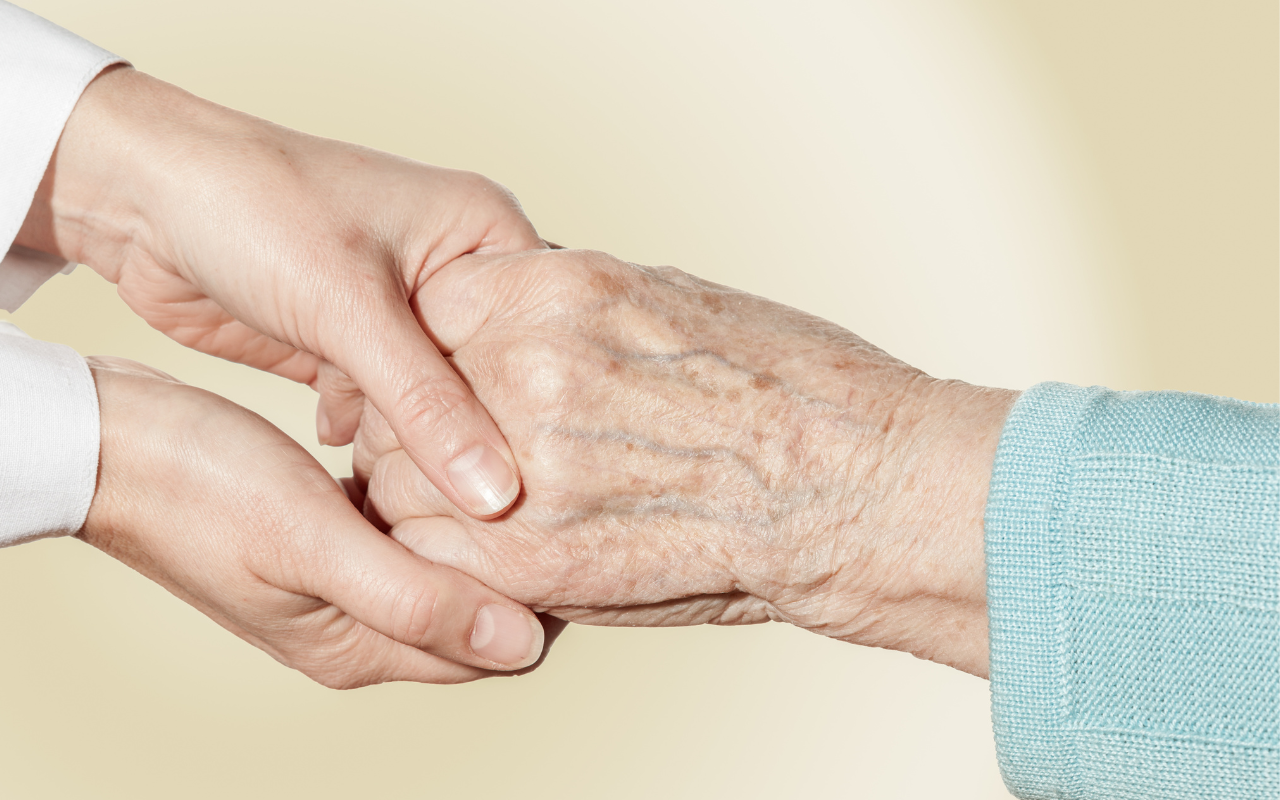 Two pairs of hands - one older and one younger