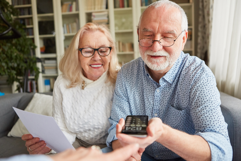 Two Seniors with a calculator