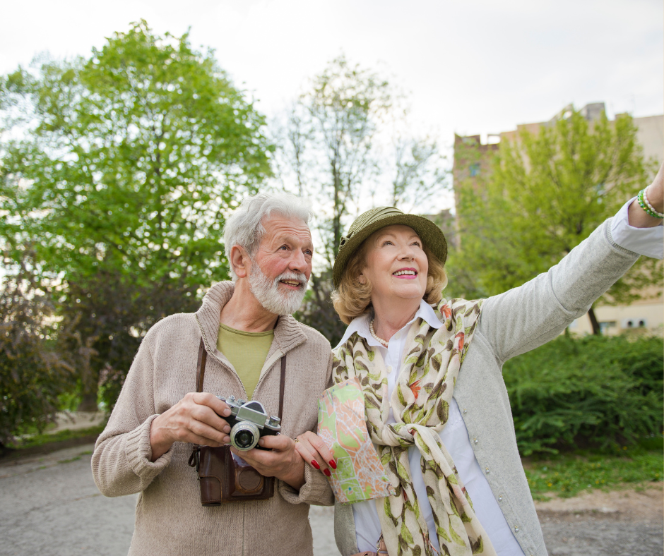 Two Seniors with a camera Travelling
