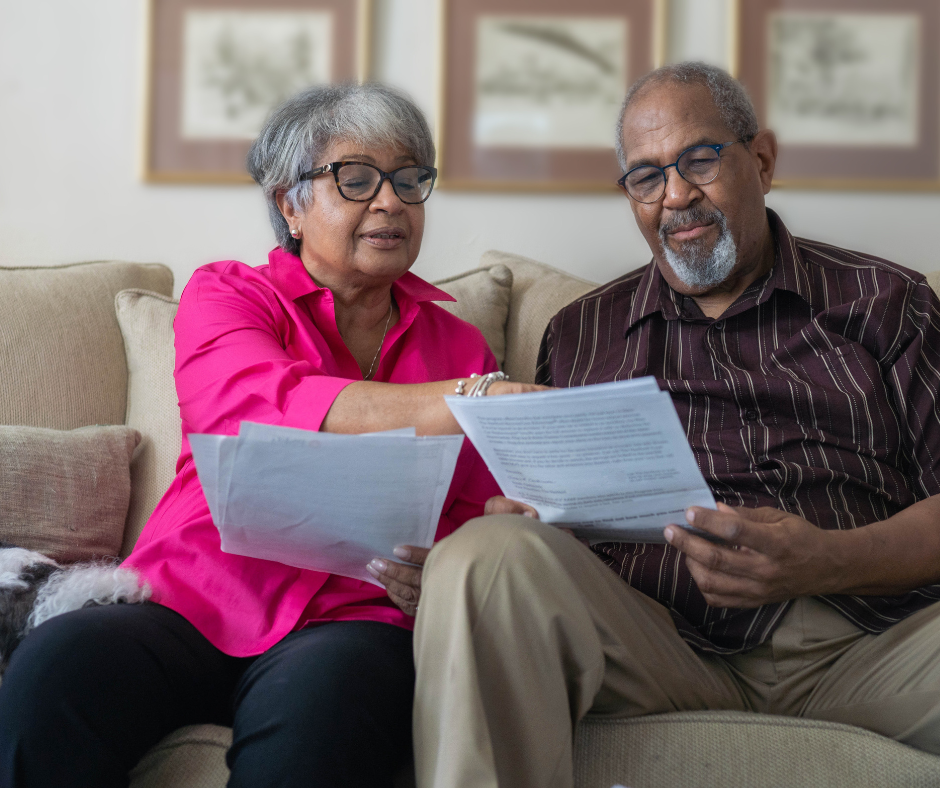 Two Seniors looking at documents