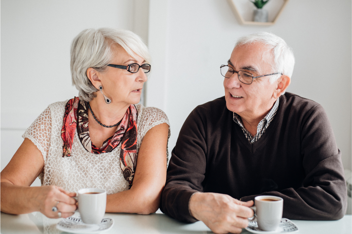 Two Seniors Man and Women drinking coffee